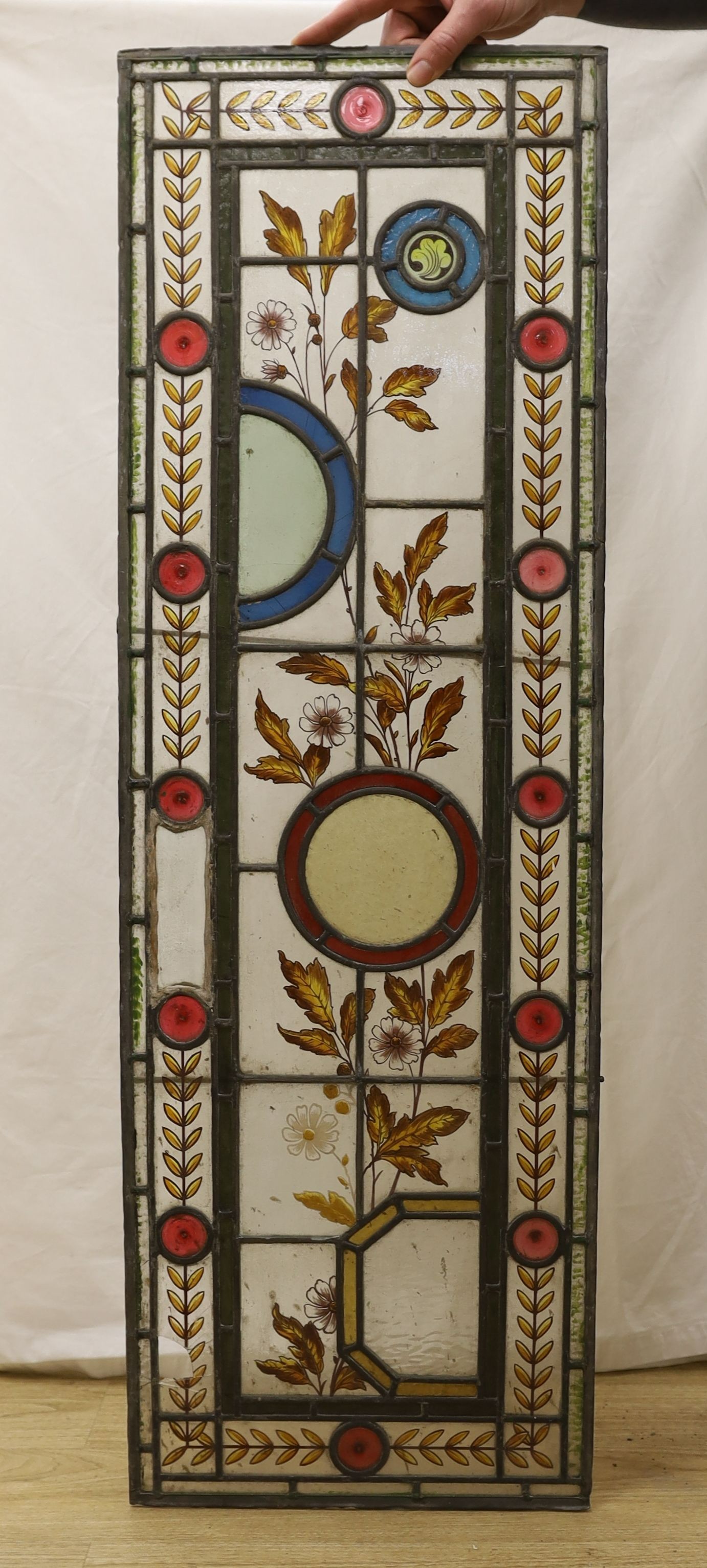 Two pairs of 19th century leaded and stained glass panels, 111cms high x 36.5 wide.